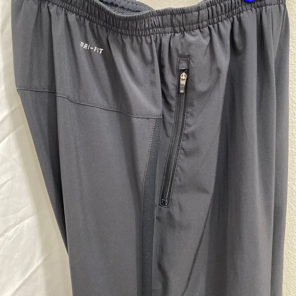 Nike Men’s Dri-Fit black running joggers. Size small.